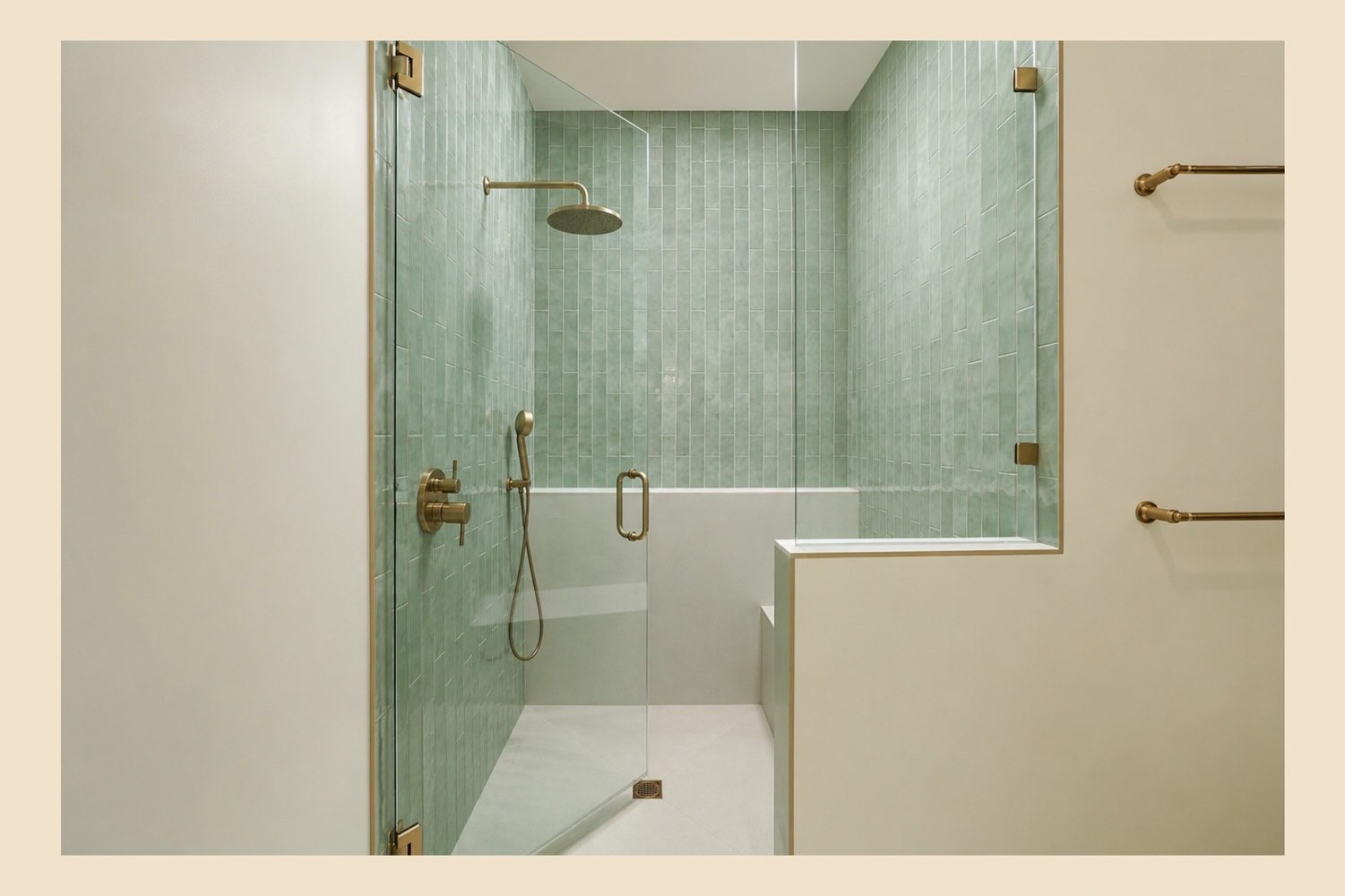 Walk-in shower finished in soft green tile